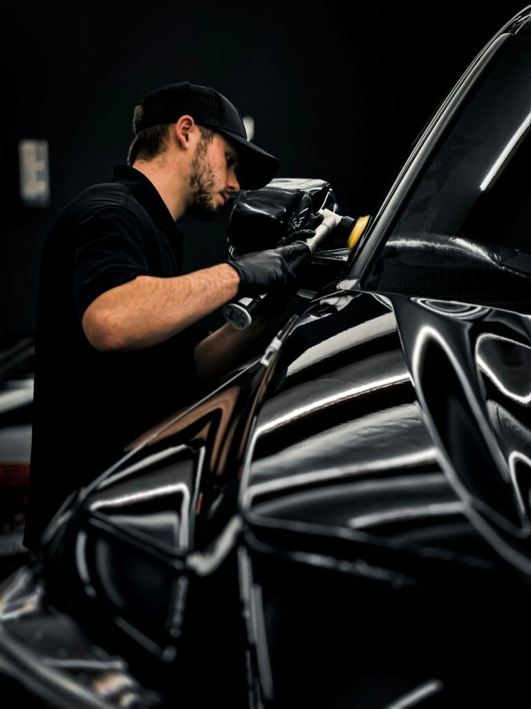 Waxing a car with a professional mobile detailing setup