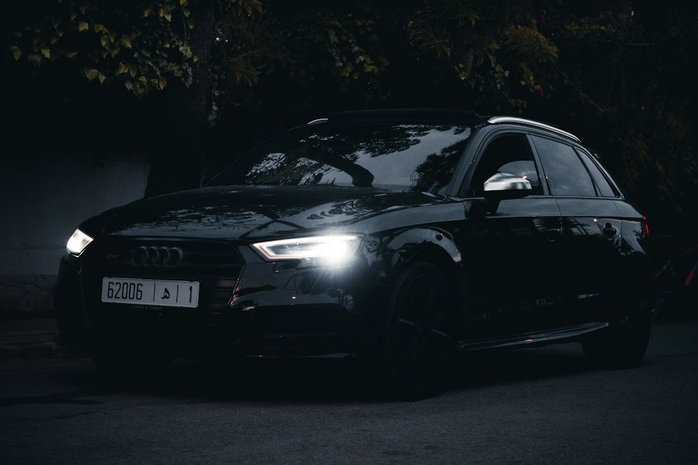 Glossy black coupe after a ceramic coating