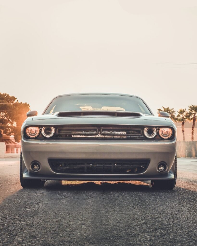 Front headlights of a grey muscle car
