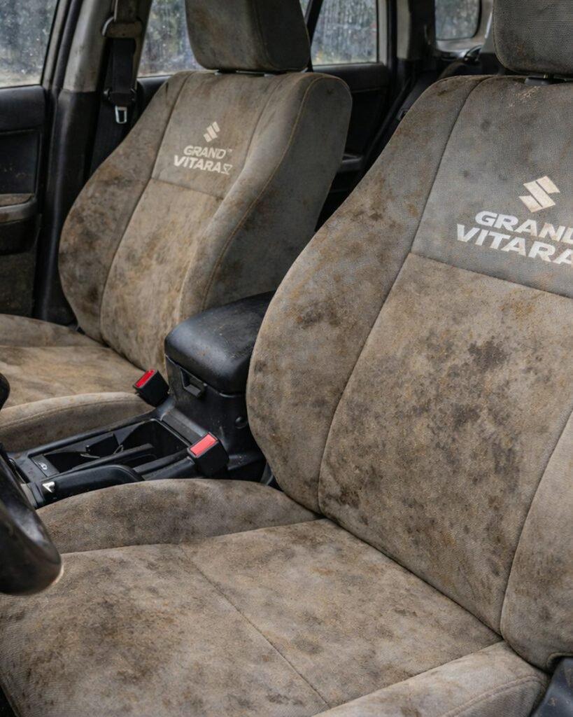 Heavily soiled fabric car seats before cleaning