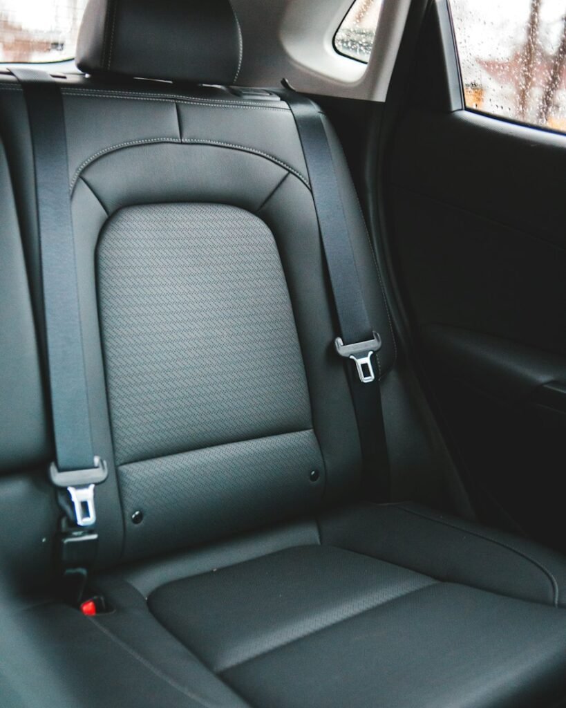 Close-up of a clean black leather car seat