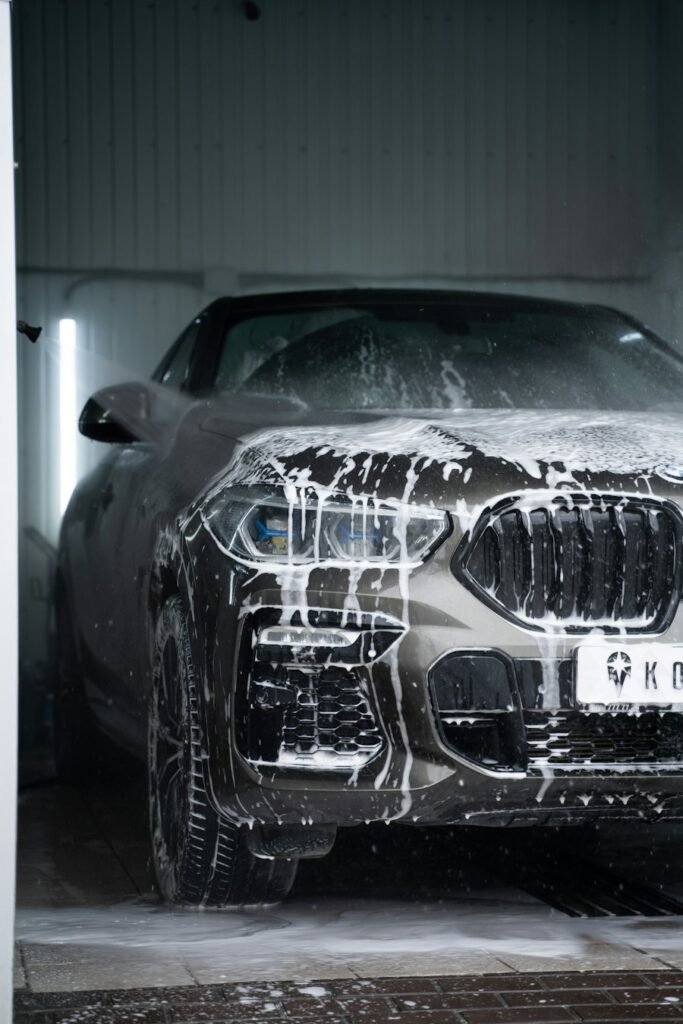 Car covered in foam during a signature full detail